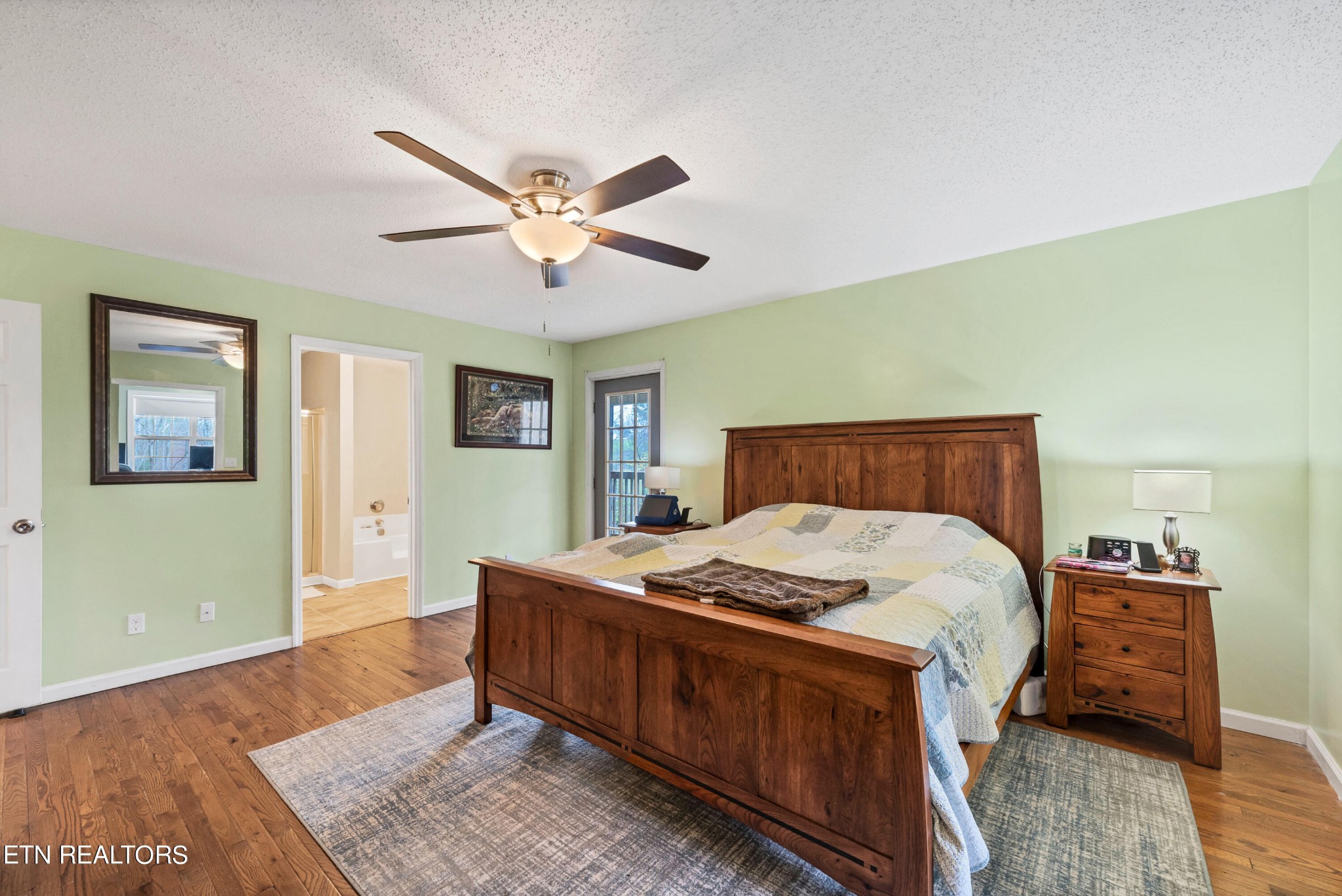 165 Colditz Oneida, TN 37841 - Photo 28 of 57 a bedroom with a bed and wooden floor