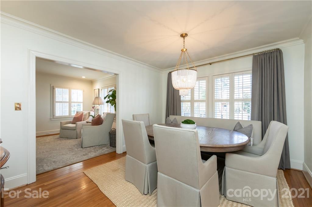 2901 Idlewood Circle Charlotte, NC 28209 - Photo 13 of 48 a view of a dining room with furniture wooden floor and chandelier