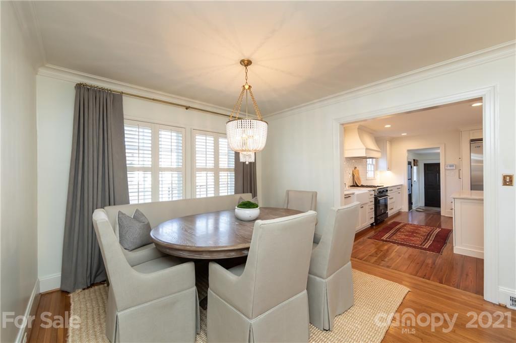 2901 Idlewood Circle Charlotte, NC 28209 - Photo 14 of 48 a living room with furniture and a chandelier