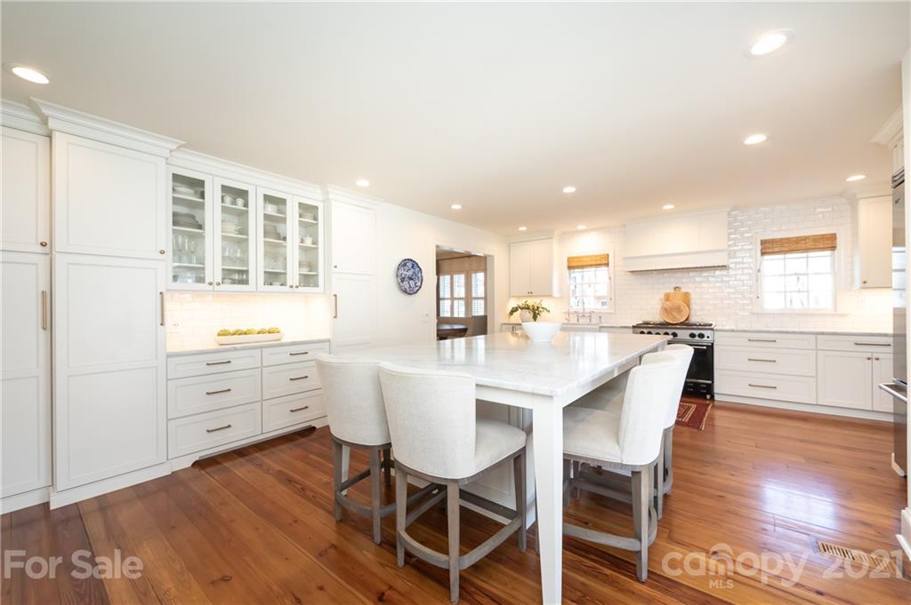 2901 Idlewood Circle Charlotte, NC 28209 - Photo 15 of 48 a view of a dining room with furniture and wooden floor