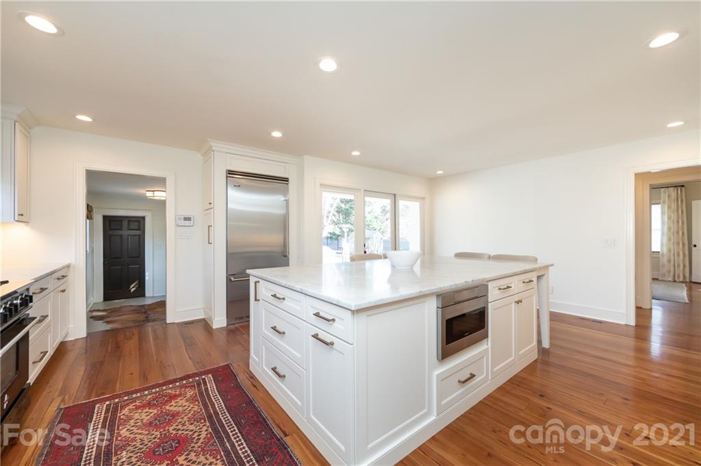 2901 Idlewood Circle Charlotte, NC 28209 - Photo 19 of 48 a kitchen with stainless steel appliances granite countertop a stove and a sink