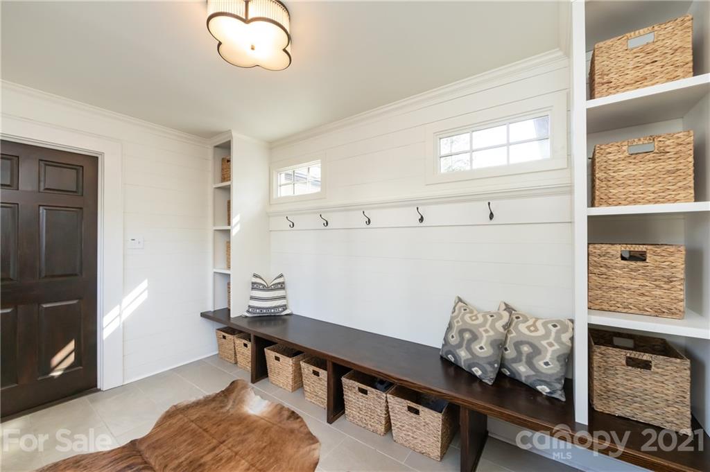 2901 Idlewood Circle Charlotte, NC 28209 - Photo 21 of 48 a view of a workspace with furniture and a window