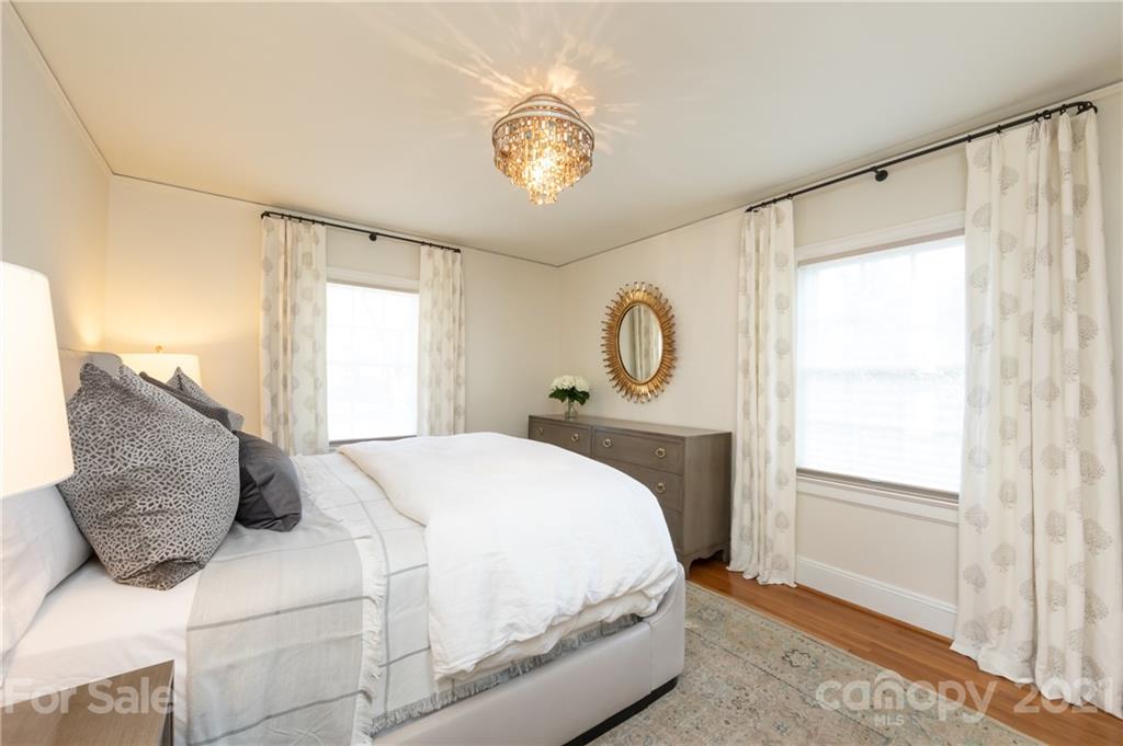 2901 Idlewood Circle Charlotte, NC 28209 - Photo 23 of 48 a bedroom with a large bed and a window