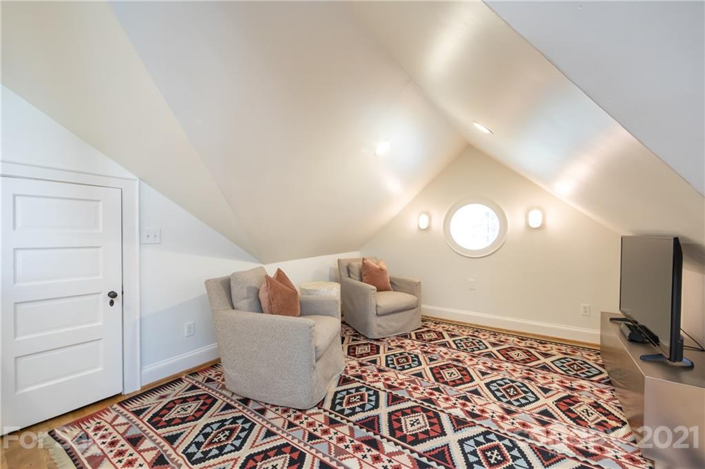 2901 Idlewood Circle Charlotte, NC 28209 - Photo 31 of 48 a living room with furniture and a flat screen tv