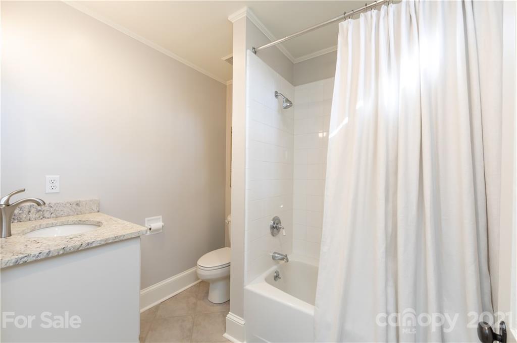 2901 Idlewood Circle Charlotte, NC 28209 - Photo 36 of 48 a bathroom with a granite countertop sink toilet and shower