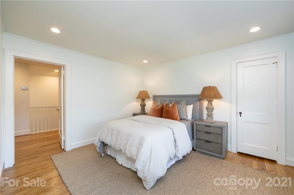 2901 Idlewood Circle Charlotte, NC 28209 - Photo 37 of 48 a bedroom with a bed and a cabinets