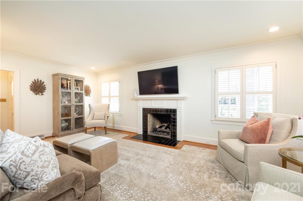 2901 Idlewood Circle Charlotte, NC 28209 - Photo 8 of 48 a spacious bedroom with a bed and a fireplace