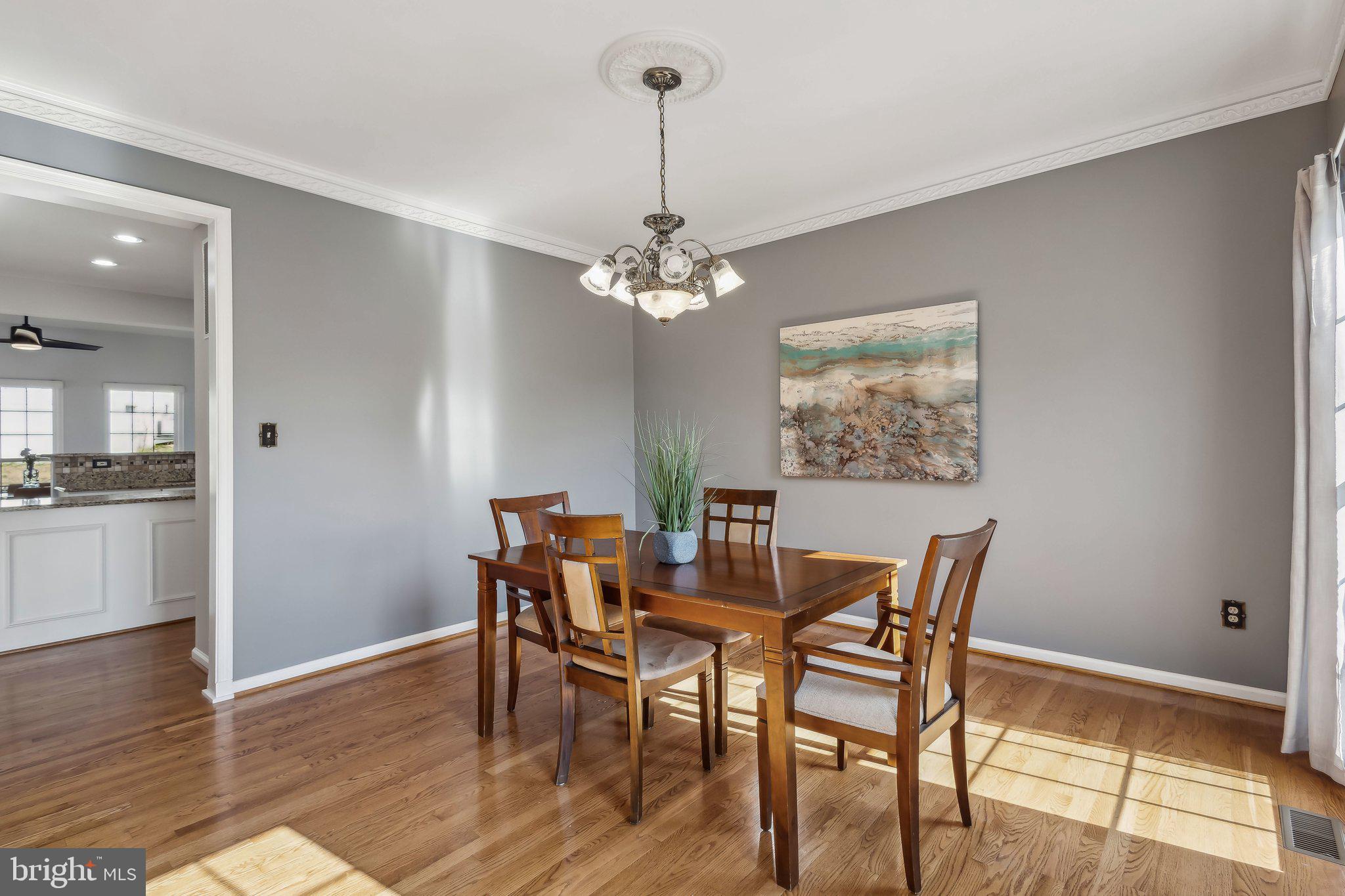 169 Basalt Drive Fredericksburg, VA 22406 - Photo 23 of 56 a view of a dining room with furniture and wooden floor