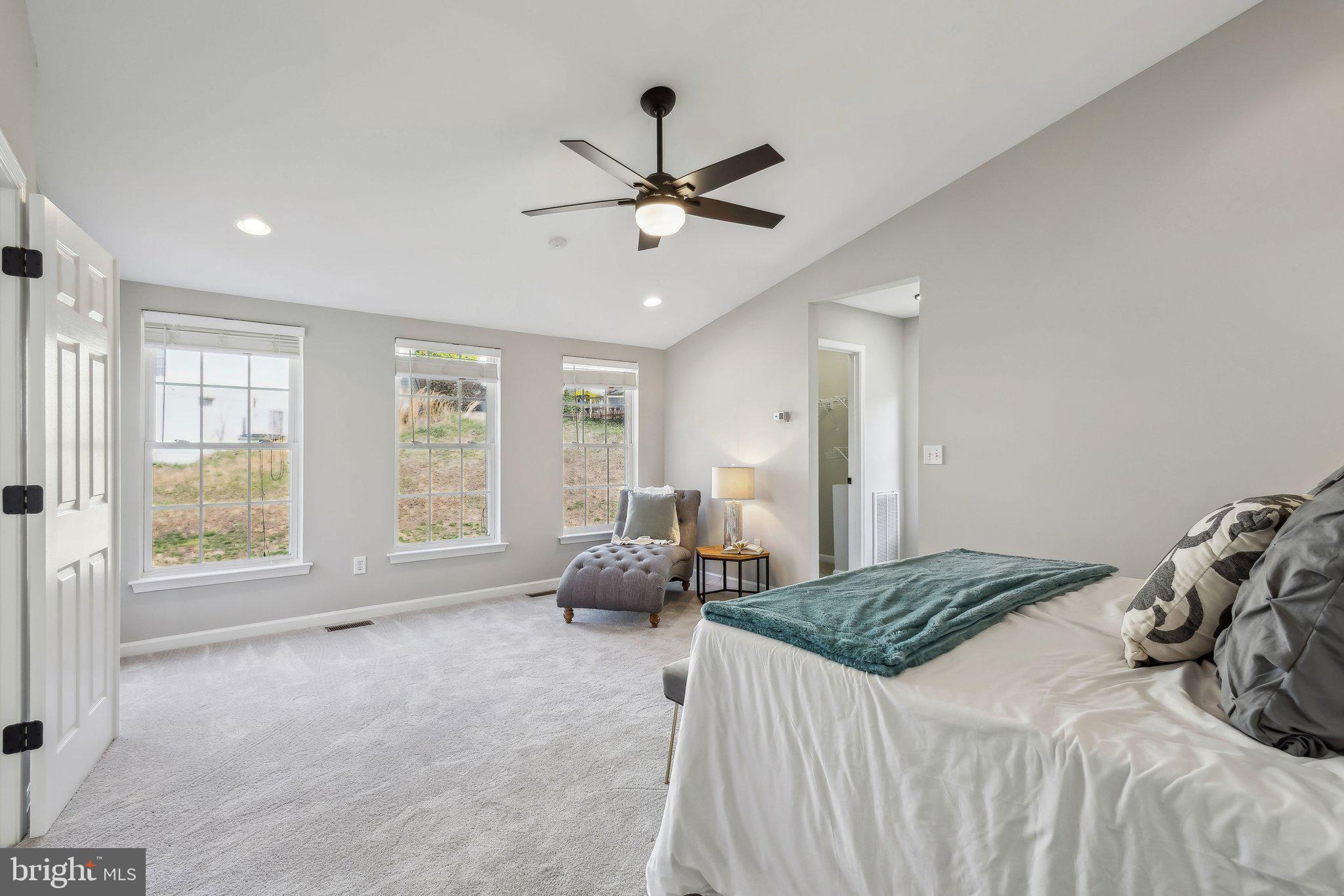 169 Basalt Drive Fredericksburg, VA 22406 - Photo 29 of 56 a bedroom with a bed and a large window