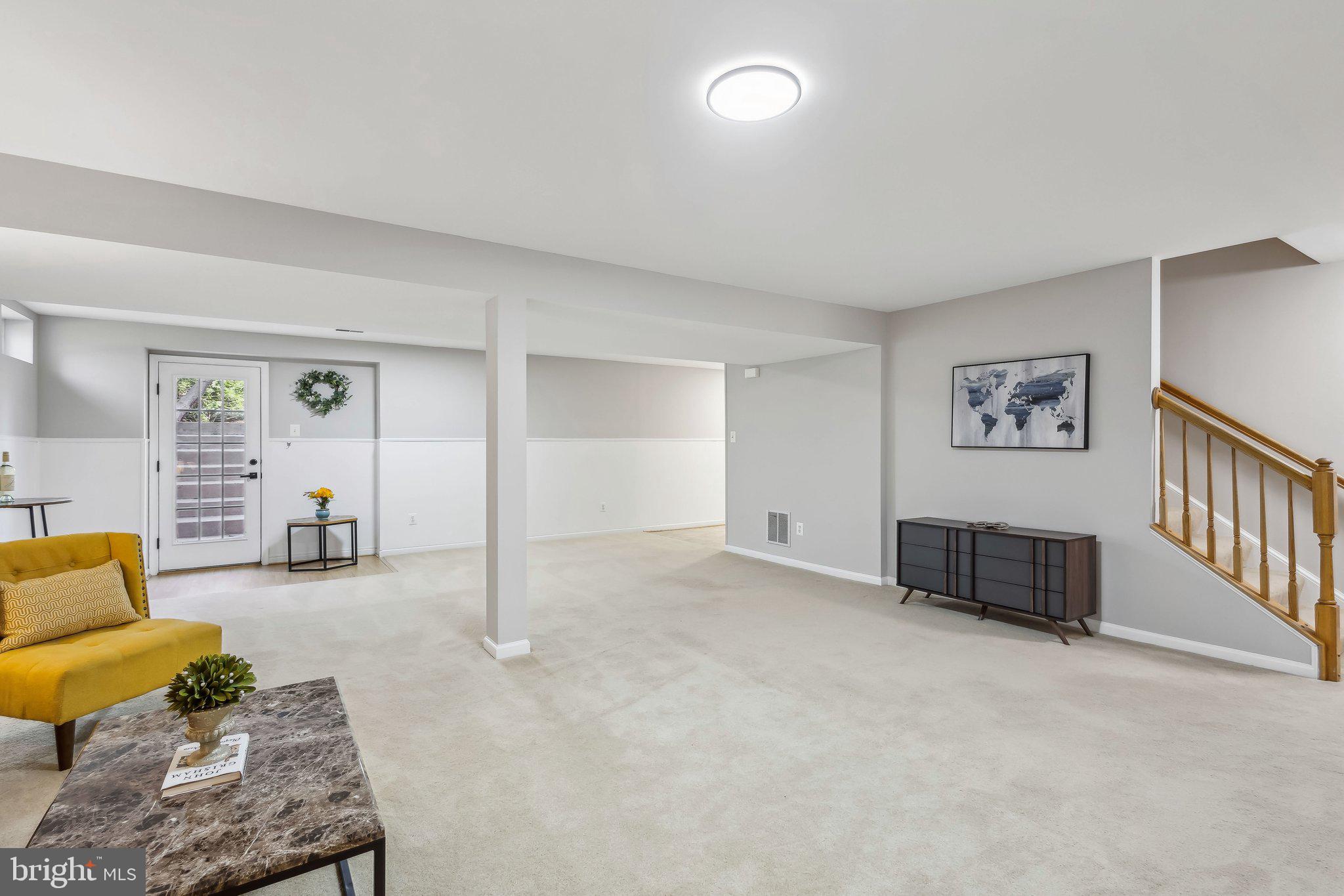 169 Basalt Drive Fredericksburg, VA 22406 - Photo 46 of 56 a living room with furniture and a flat screen tv