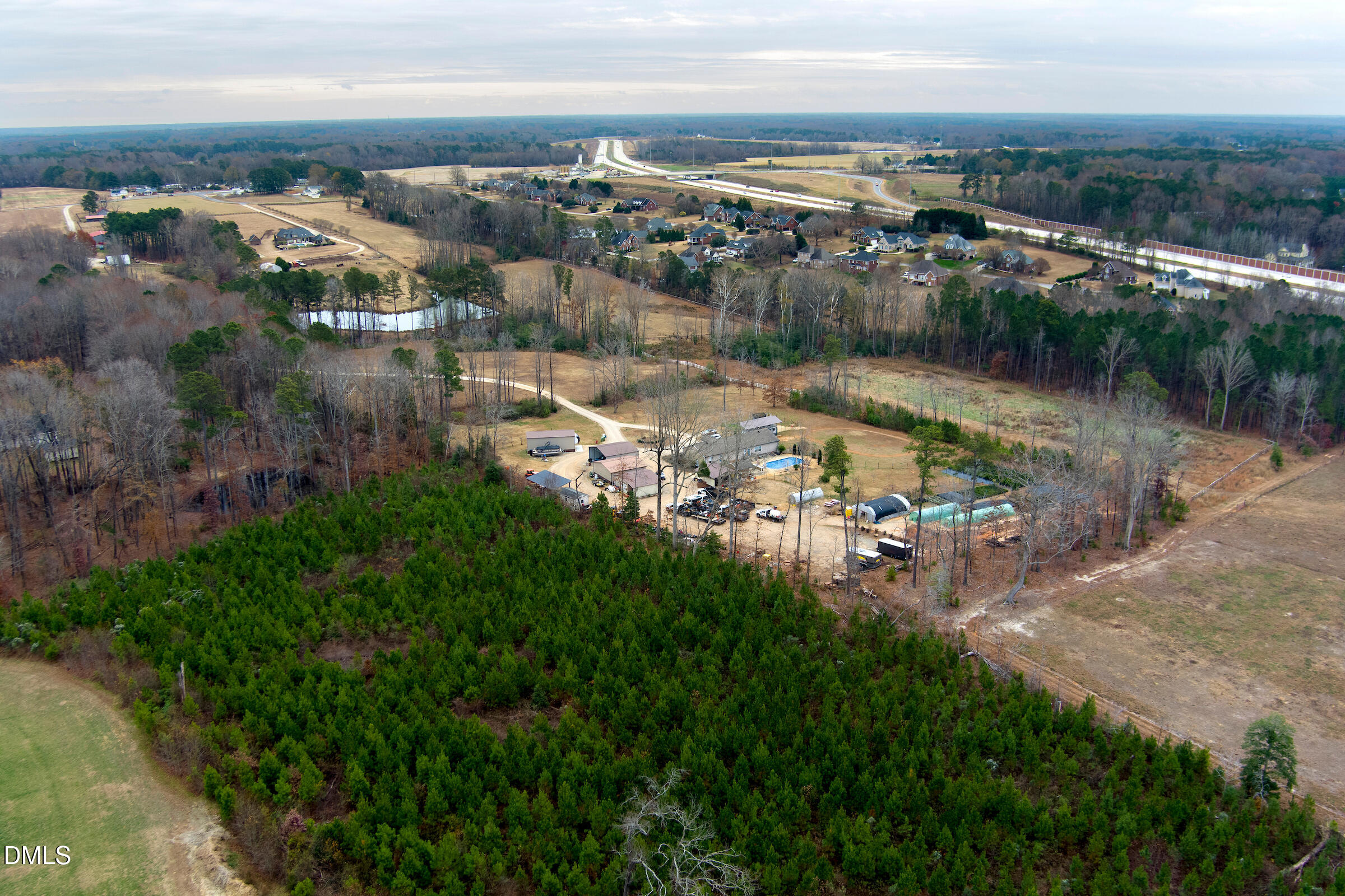 9002 Old Stage Road Raleigh, NC 27603 - Photo 2 of 11 an aerial view of residential houses with outdoor space and lake view
