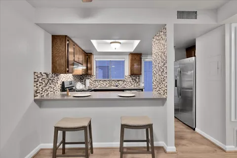 a kitchen with a stove and a sink