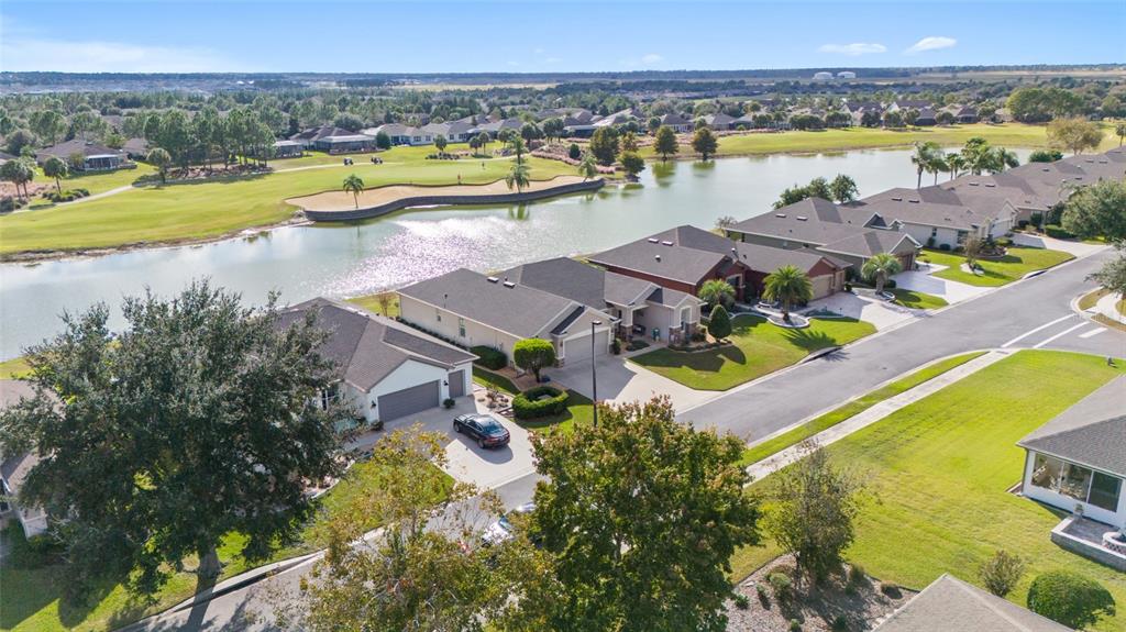 9479 Southwest 71st Loop Ocala, FL 34481 - Photo 2 of 84 a view of a swimming pool and lake view