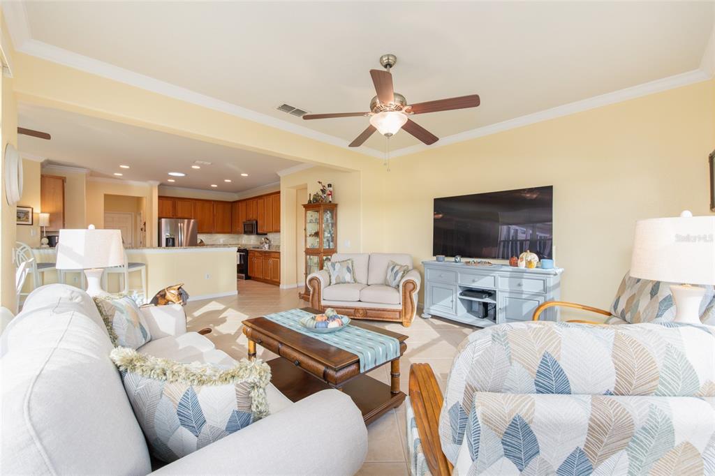 9479 Southwest 71st Loop Ocala, FL 34481 - Photo 44 of 84 a living room with furniture and a flat screen tv