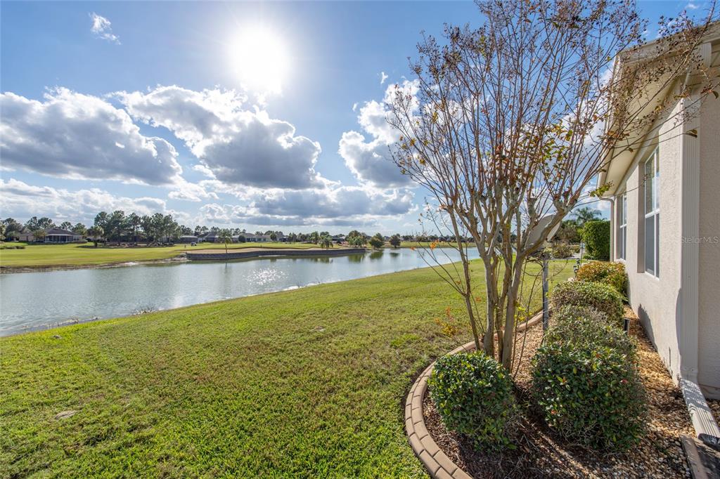 9479 Southwest 71st Loop Ocala, FL 34481 - Photo 57 of 84 a view of a lake with houses in the back