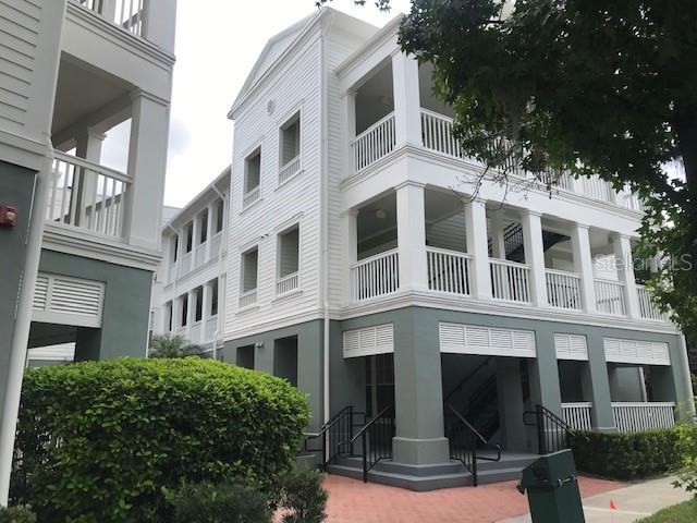 599 Campus Street, Unit 599 Celebration, FL 34747 - Photo 1 of 24 a front view of a multi story building