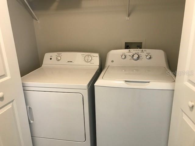 599 Campus Street, Unit 599 Celebration, FL 34747 - Photo 12 of 24 a utility room with dryer and washer