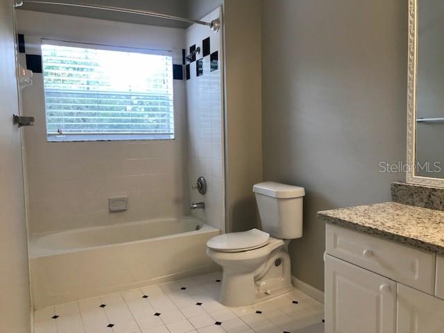 599 Campus Street, Unit 599 Celebration, FL 34747 - Photo 14 of 24 a bathroom with a toilet a sink and a bathtub