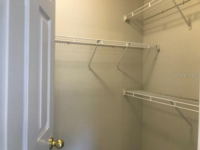 599 Campus Street, Unit 599 Celebration, FL 34747 - Photo 15 of 24 a view of a room with racks on the wall
