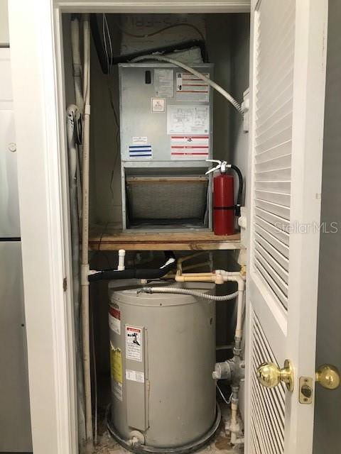 599 Campus Street, Unit 599 Celebration, FL 34747 - Photo 7 of 24 a utility room with dryer and washer