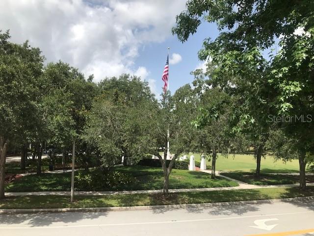 599 Campus Street, Unit 599 Celebration, FL 34747 - Photo 9 of 24 a front view of a house with a yard