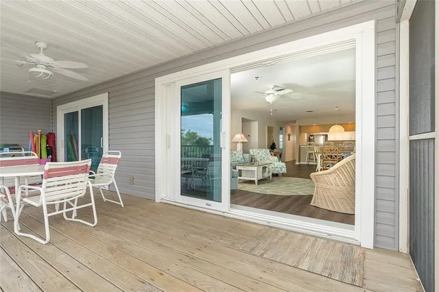a view of a patio with table and chairs