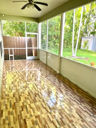 a view of an empty room and a window