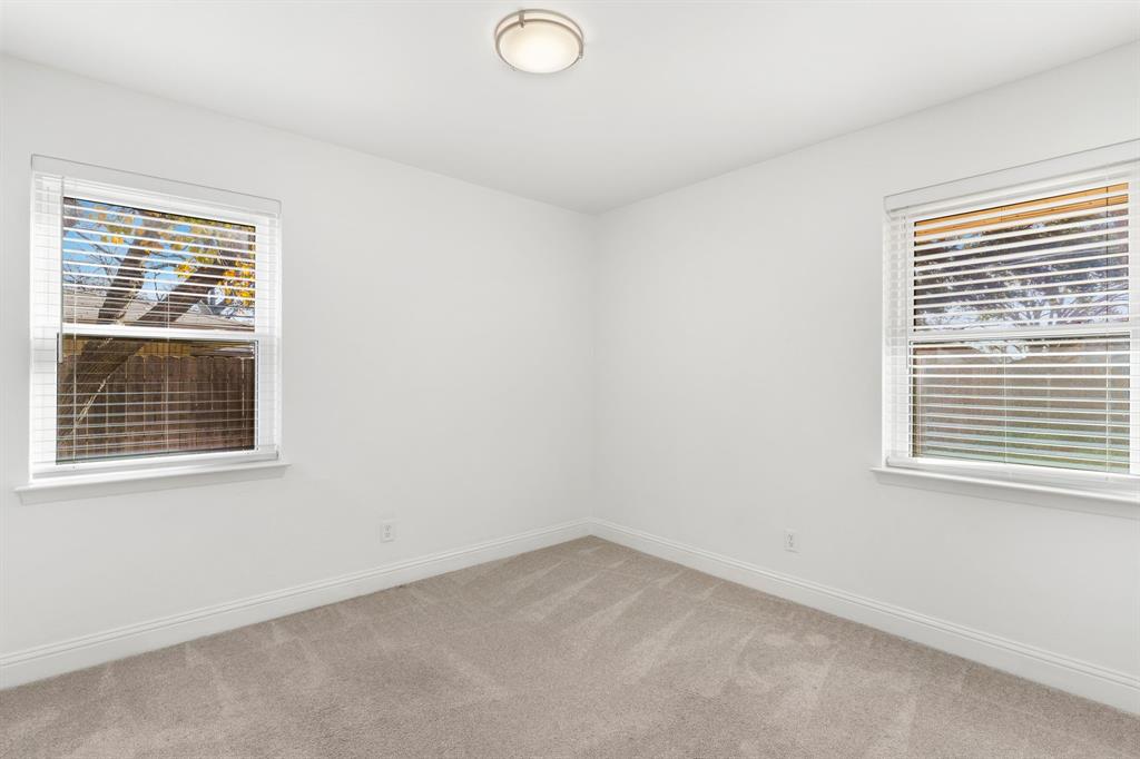 831 Warren Way Richardson, TX 75080 - Photo 12 of 18 an empty room with a window