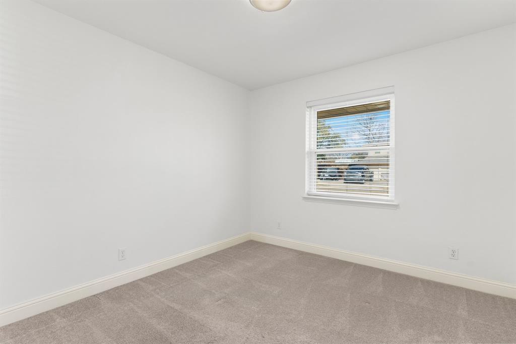 831 Warren Way Richardson, TX 75080 - Photo 14 of 18 an empty room with a window