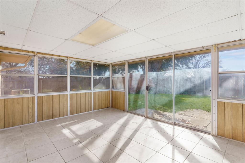 831 Warren Way Richardson, TX 75080 - Photo 15 of 18 a view of empty room with wooden floor and fan