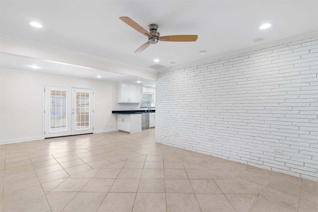 831 Warren Way Richardson, TX 75080 - Photo 7 of 18 a view of an empty room with a window