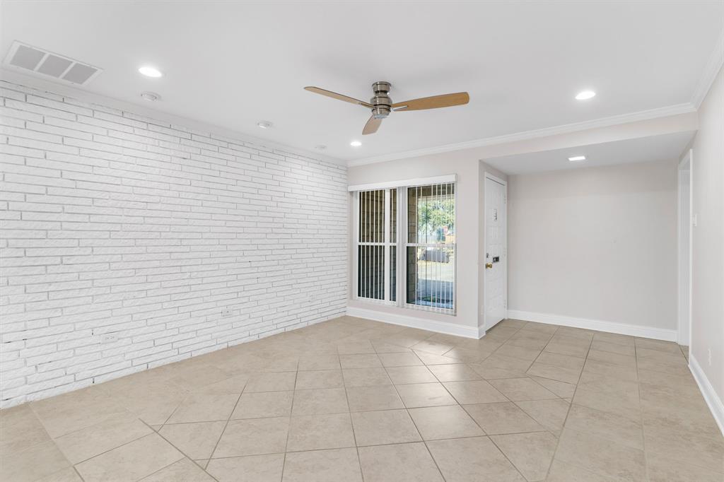 831 Warren Way Richardson, TX 75080 - Photo 8 of 18 a view of an empty room with a window