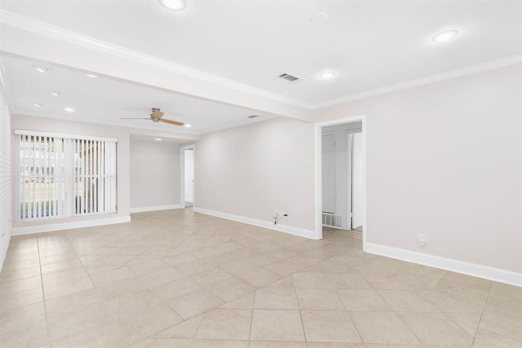 831 Warren Way Richardson, TX 75080 - Photo 9 of 18 a view of an empty room with a window