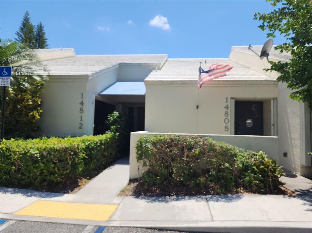 14808 Southwest 124th Court Miami, FL 33186 - Photo 1 of 7 a front view of a house with a yard and garage