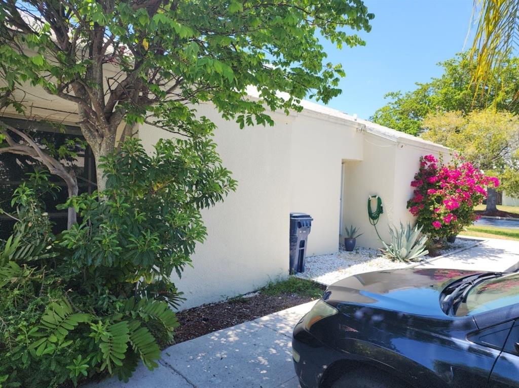 14808 Southwest 124th Court Miami, FL 33186 - Photo 3 of 7 a view of a patio with table and chairs potted plants