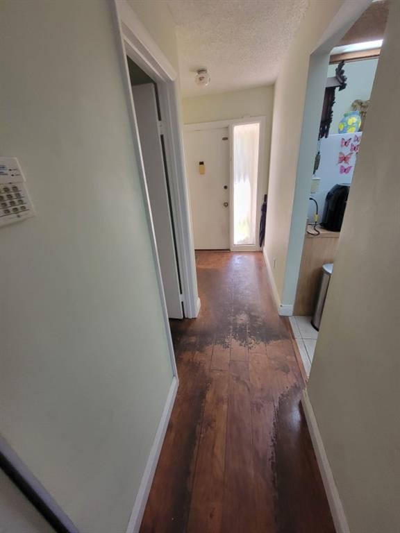 14808 Southwest 124th Court Miami, FL 33186 - Photo 5 of 7 a view of a hallway to a house with stairs
