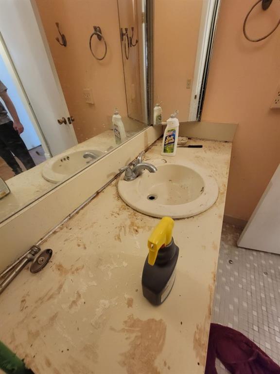 14808 Southwest 124th Court Miami, FL 33186 - Photo 6 of 7 a bathroom with a sink and a mirror