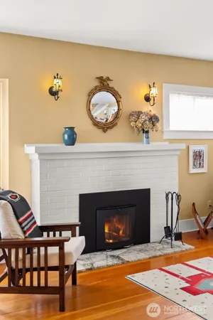 a view of living room with furniture and fireplace