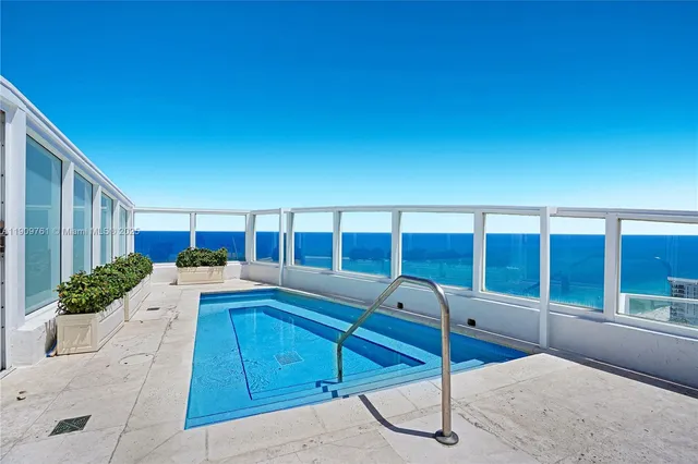 a view of a city with tall buildings in ocean