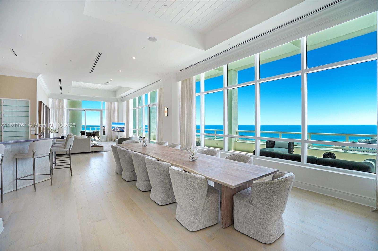 4401 Collins Avenue, Unit PHSOUTH Miami Beach, FL 33140 - Photo 16 of 92 a kitchen with a large counter top furniture and a view of living room