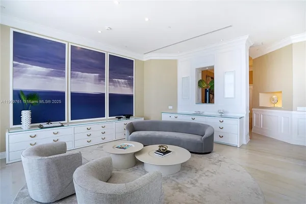 a kitchen with a dining table chairs cabinets and stainless steel appliances