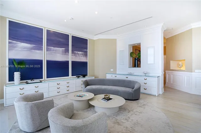 a kitchen with a dining table chairs cabinets and stainless steel appliances