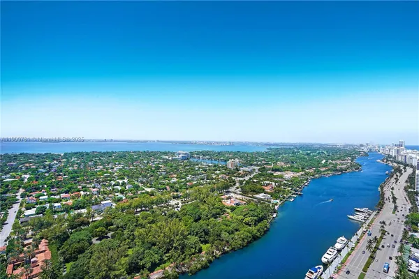 a bedroom with a large bed and a couch