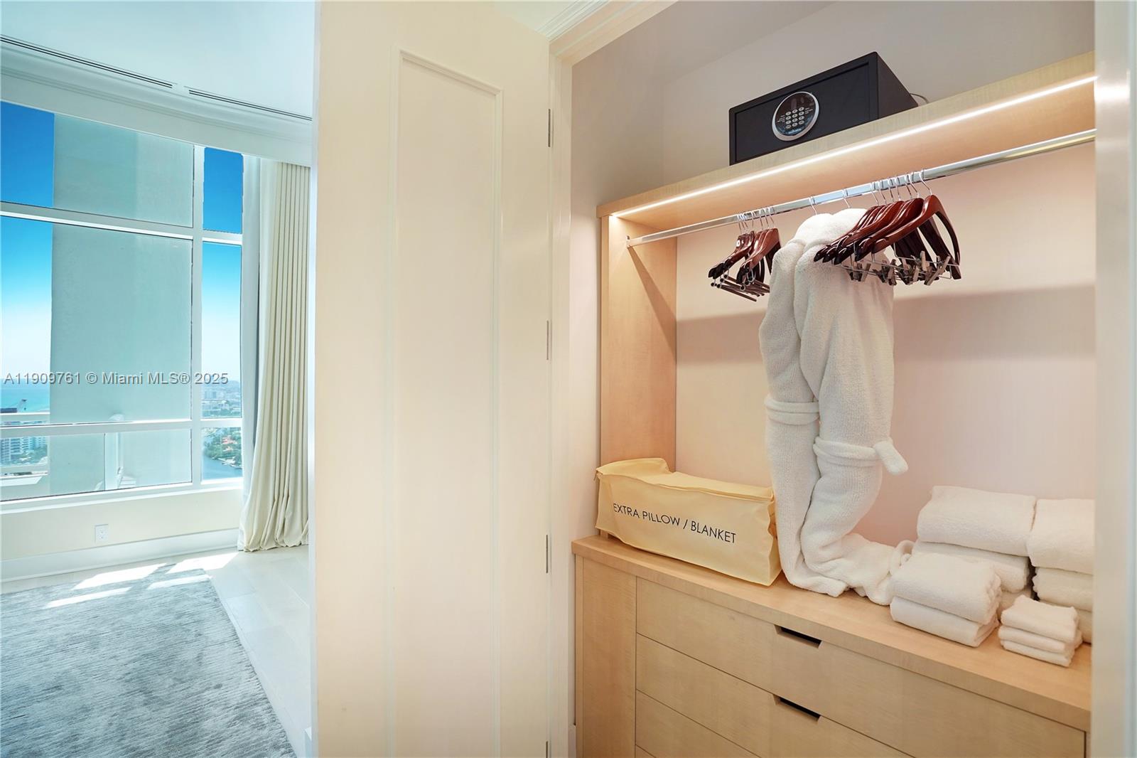 4401 Collins Avenue, Unit PHSOUTH Miami Beach, FL 33140 - Photo 53 of 92 a view of walk in closet with clothes and shoes