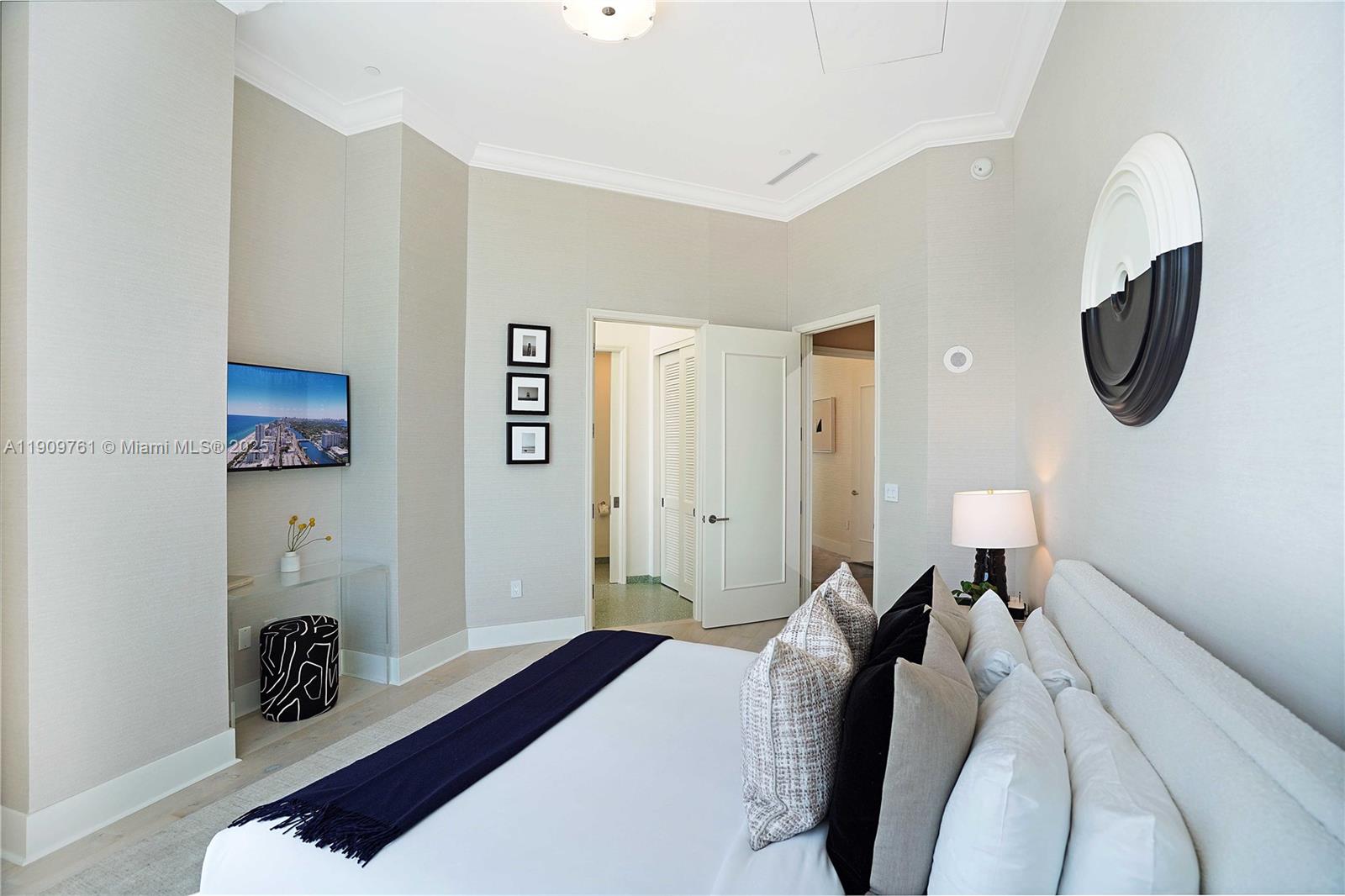 4401 Collins Avenue, Unit PHSOUTH Miami Beach, FL 33140 - Photo 63 of 92 a bedroom with a bed and a lamp