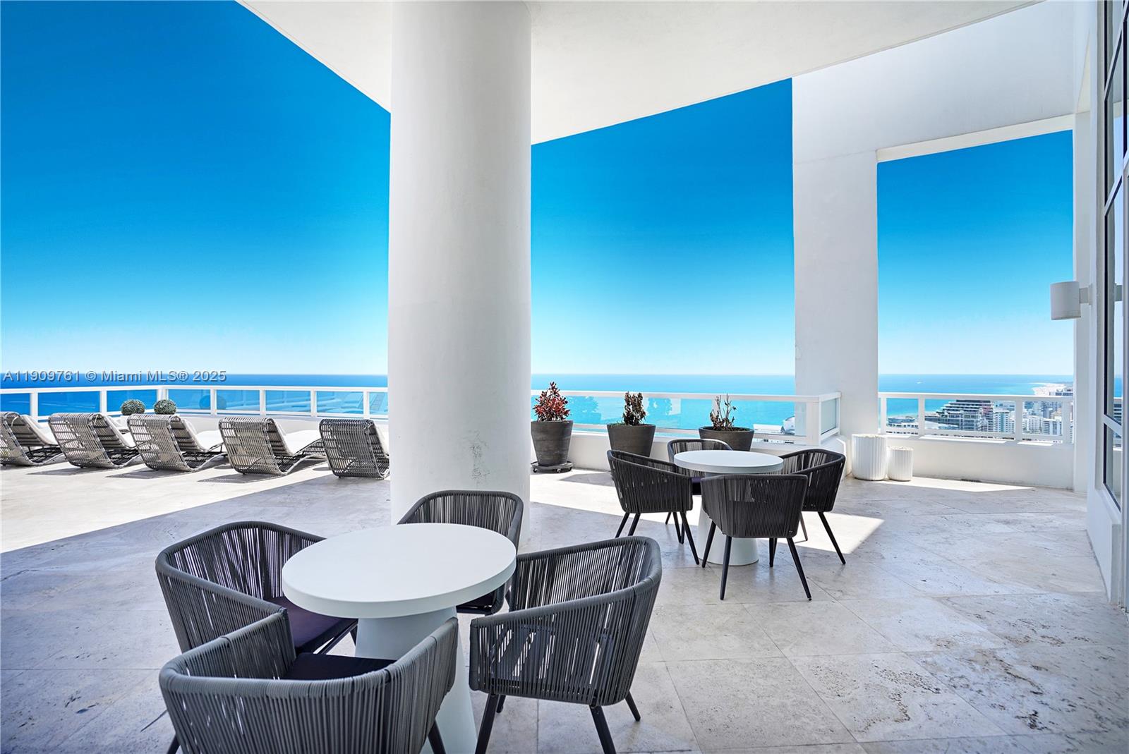 4401 Collins Avenue, Unit PHSOUTH Miami Beach, FL 33140 - Photo 7 of 92 a dining room with furniture and a floor to ceiling window