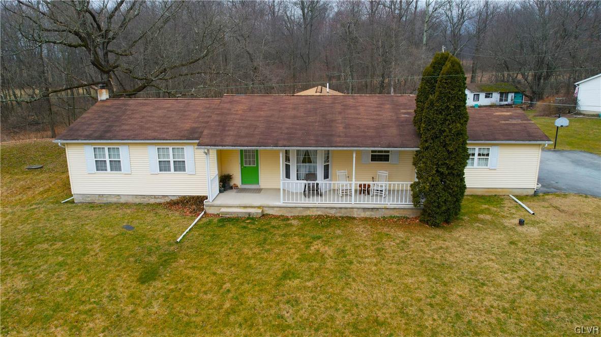 8650 Ulrich Road Germansville, PA 18053 - Photo 4 of 50 a front view of house with swimming pool and porch with furniture