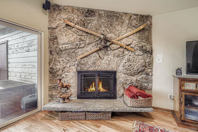 a kitchen with stainless steel appliances granite countertop a kitchen island a stove a table and chairs