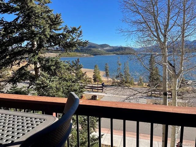 a front view of a residential apartment building with a yard