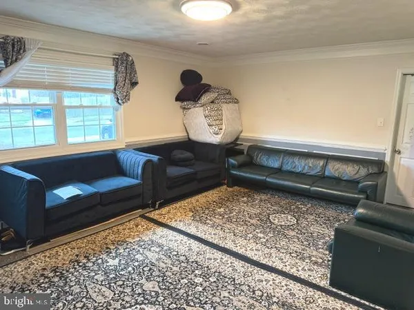 a living room with a couch and a table